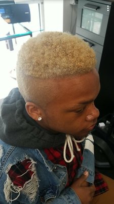 Blonde curly taper fade haircut result at Frank's