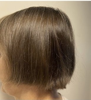 Sleek bob haircut result at Frank's Beauty Salon
